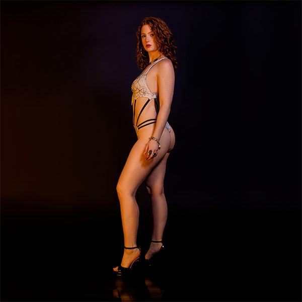 One-Piece with Strapped Detailing.